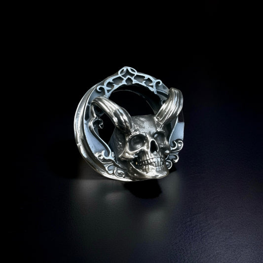 Angled view of Memento Mori 925 sterling silver skull ear tunnel (ear gauge plug)