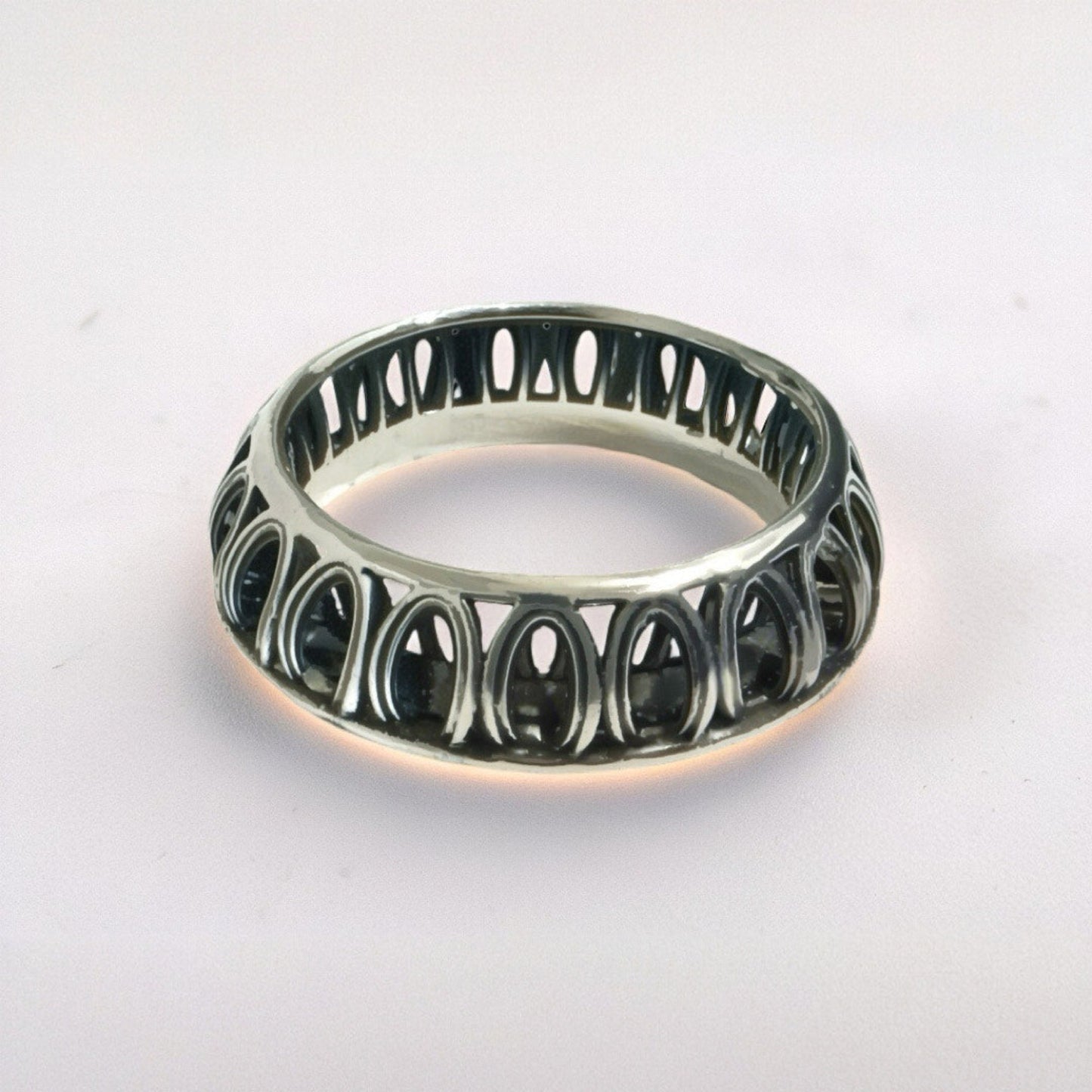 Front view of Ring of Solomon — 925 sterling silver sculptural band with oxidized contrasts