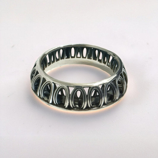 Front view of Ring of Solomon — 925 sterling silver sculptural band with oxidized contrasts