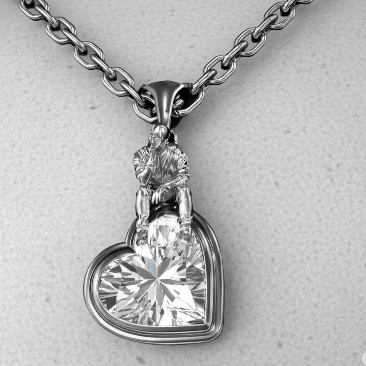 Front view of The Thinker’s Secret — 925 sterling silver heart pendant with sculptural thinker motif