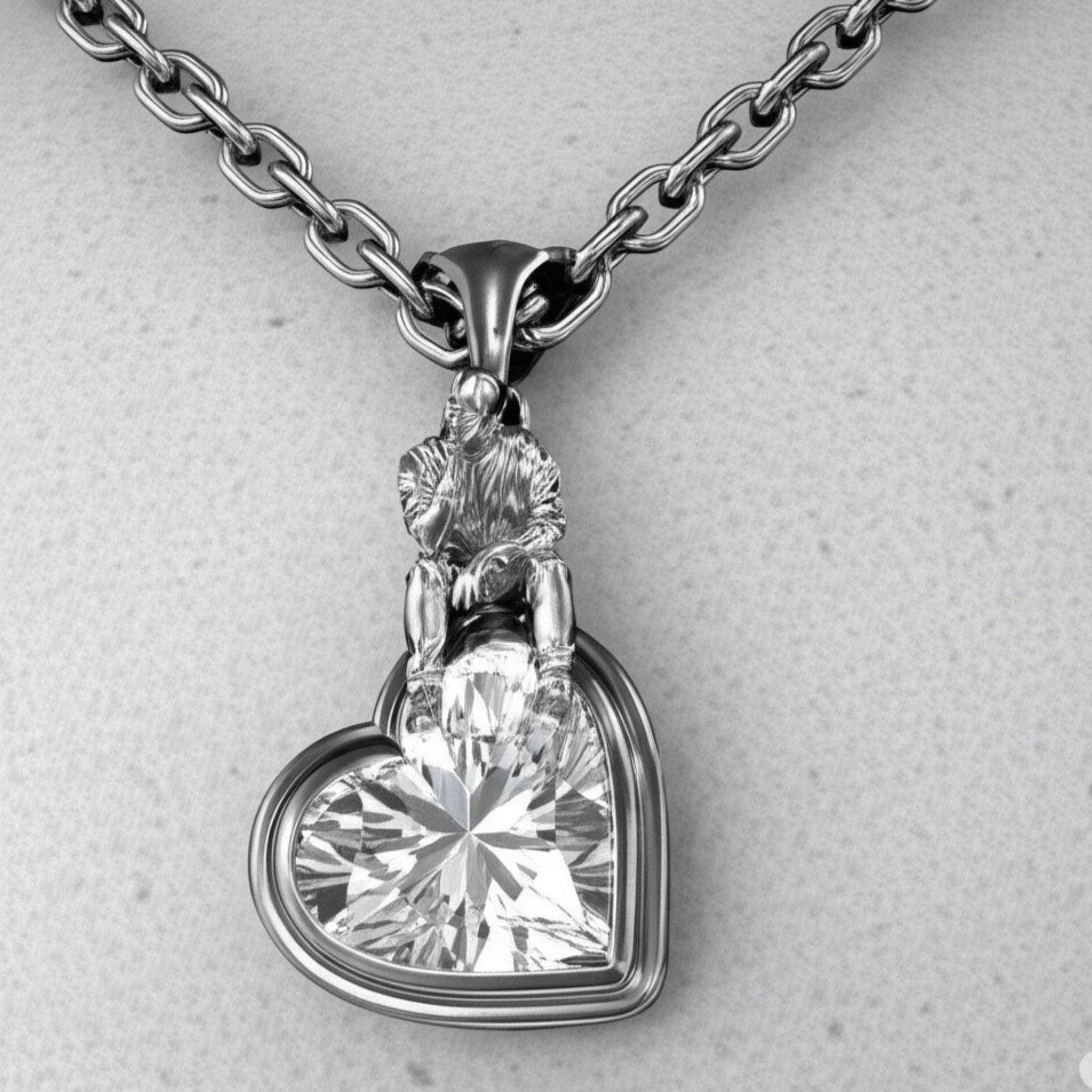 Front view of The Thinker’s Secret — 925 sterling silver heart pendant with sculptural thinker motif