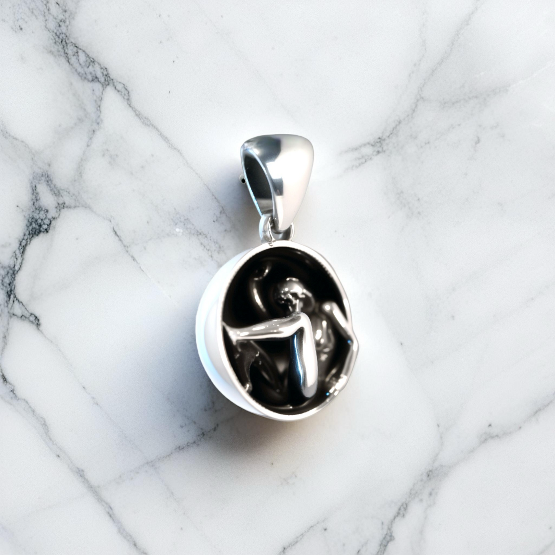 Astrea Pendant 925 sterling silver necklace photographed with artistic light, celestial talisman jewelry