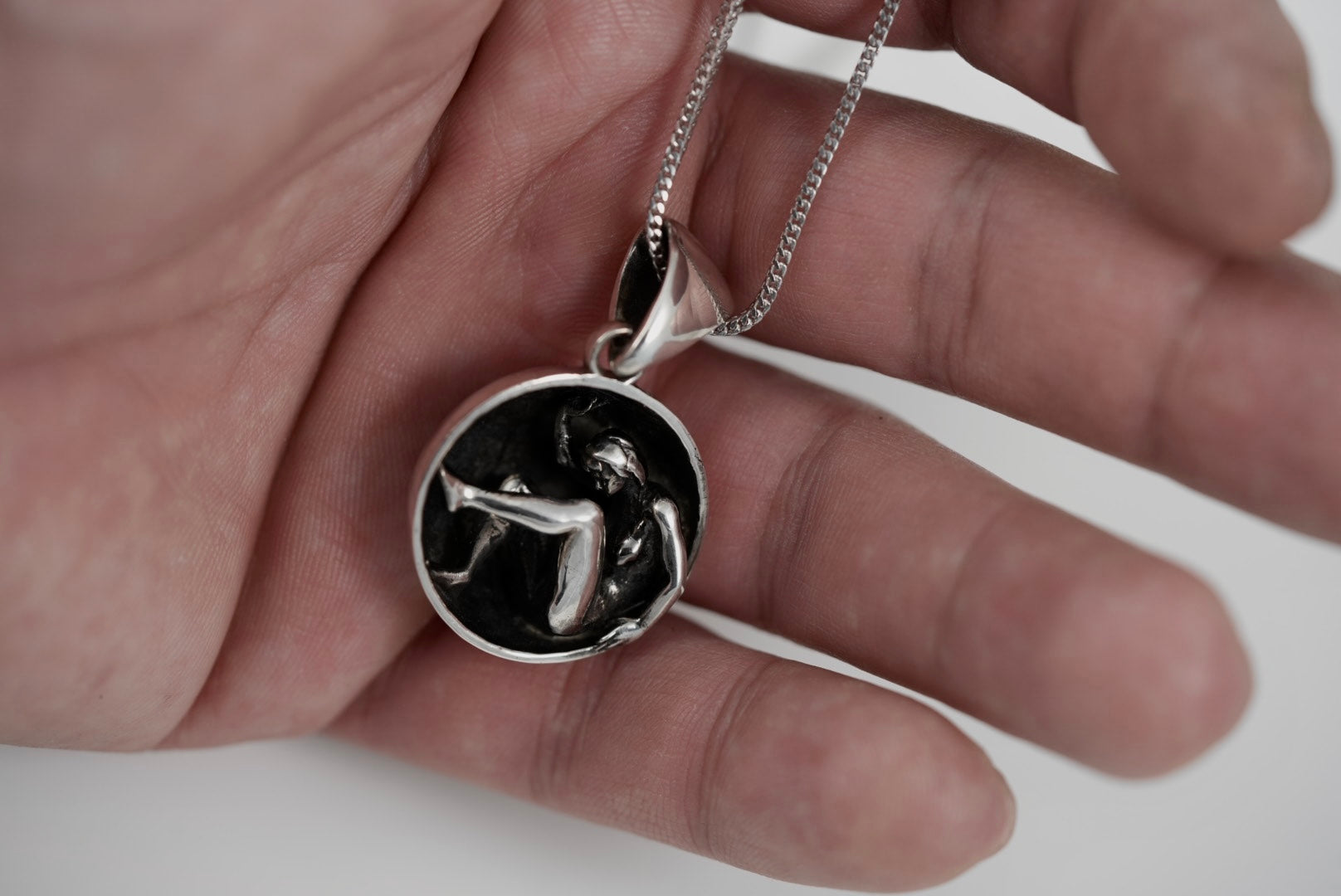 Astrea Pendant in hand for size reference, 925 sterling silver celestial talisman necklace