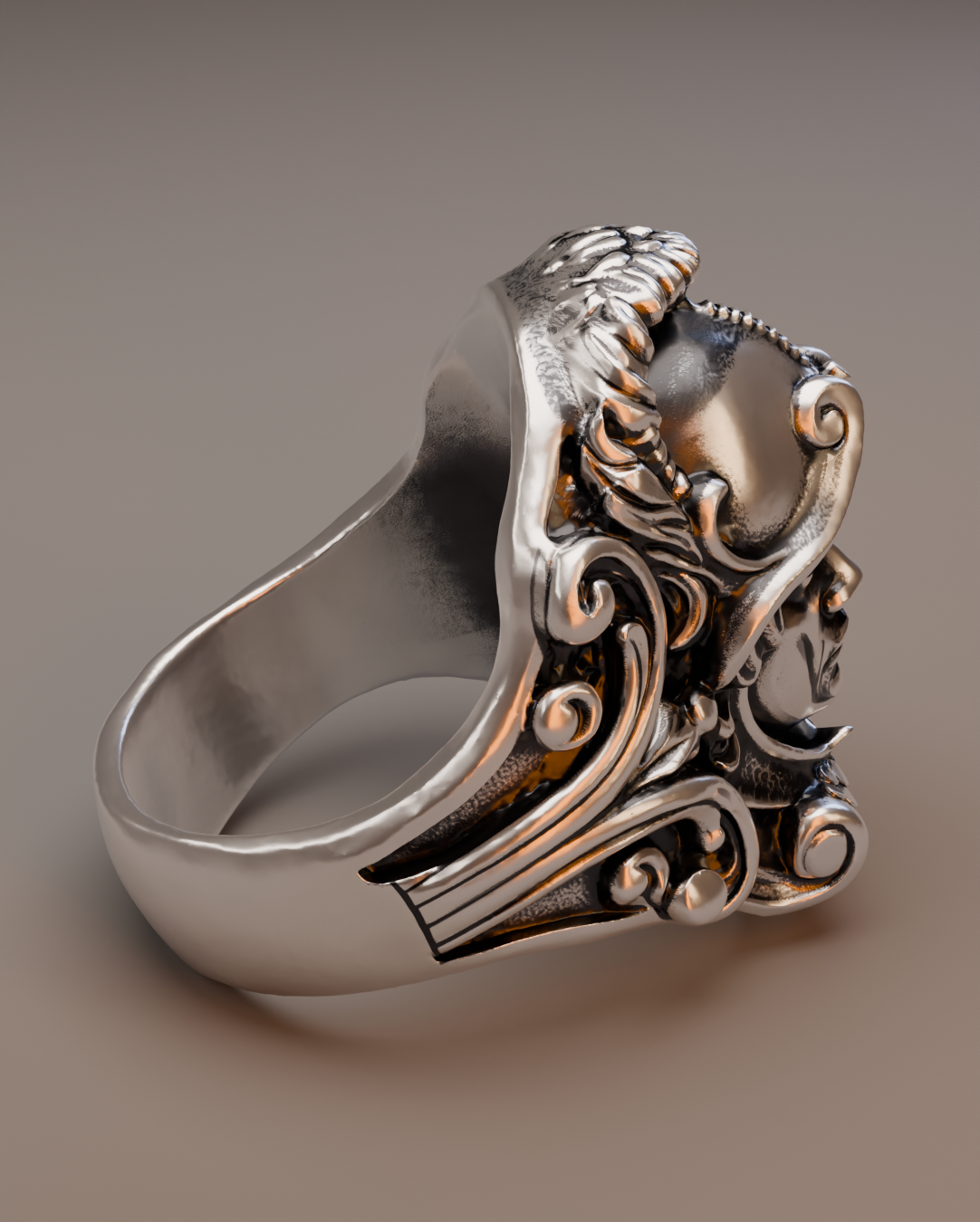close-up of sculptural silver guardian face ring with ornamental relief